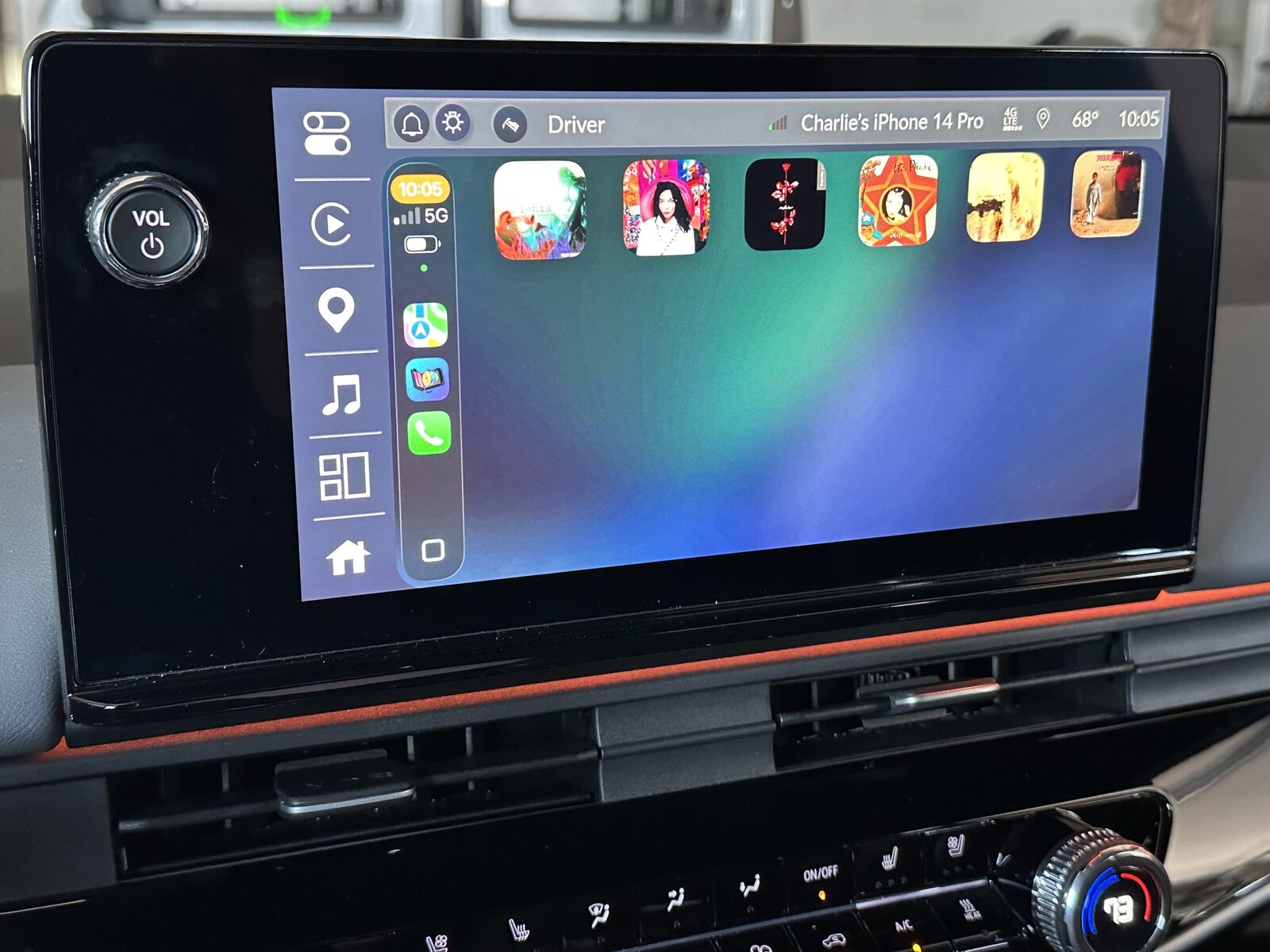 CD Wally running on a car's CarPlay screen: six album covers laid out like a CD changer.