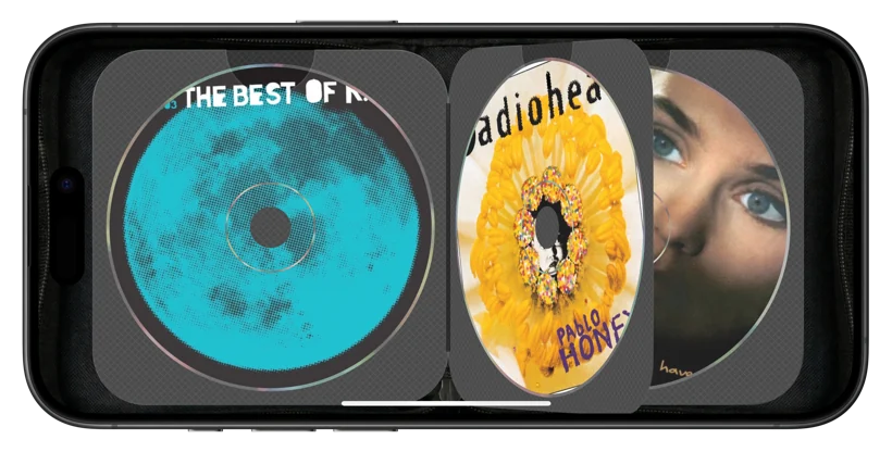 Close detail of CD Wally on an iPhone: a disc mid-spin in its woven sleeve, page flipping.